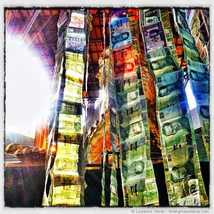 Strings of money in Thai temple