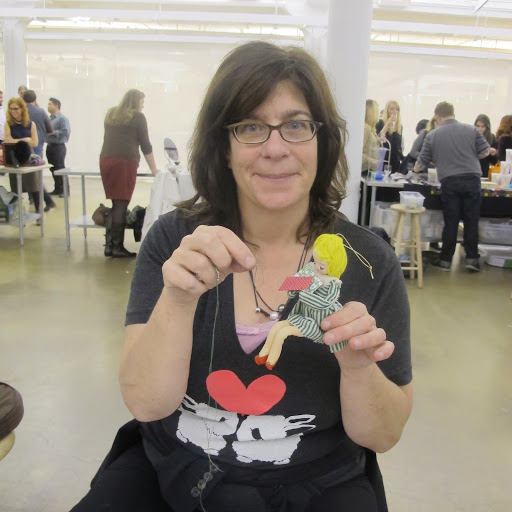 Here Hannah Milman shows off some of her creations for sale.
