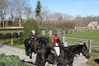 Martha's horses are fortunate to get lots of love and attention. Here Martha takes Rutger for a ride with her niece, Kristina, atop Rinze.
