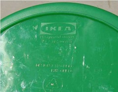 IKEA of Sweden container with a green base and yellow and orange lids