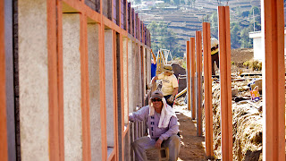 Jason of Guatamala relaxing, Susan, Marty (blue arm in back) and Victor, our driver, back right, working. Sienna Project 2011 Guatemala trip to help build school in Palanquix, Solala, Guatemala. Photos by TOM HART