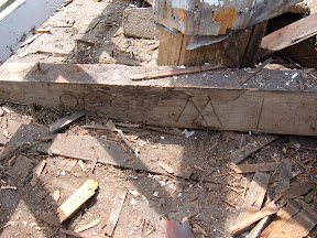 The bell deck had two layers.  The top of the bell deck was rotting and needed to be reboarded.  The initials shown here belong to the sawyer who supplied the milled wood for the project.  These initials had remained hidden for almost two hundred years before we happened upon them.    The sawyers brother was the architect of the meetinghouse whose initials can be found at the base of one of the octagon posts below the bell deck.