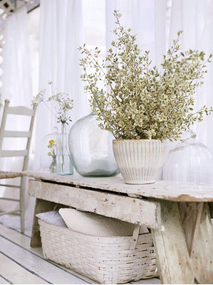 Conceal a plastic flower pot by placing it inside a pretty woven basket. Under a bench, a basket is ideal for adding storage. (edensgiftbasket.com) Conceal a plastic flower pot by placing it inside a pretty woven basket. Under a bench, a basket is ideal for adding storage. (edensgiftbasket.com)