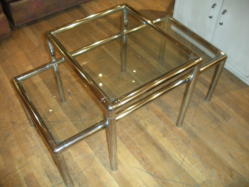 This set of matching tables would add a contemporary and glamorous touch to a living room.
