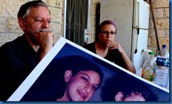 Arnold and Frimet Roth with a photo of Malka Arnold and Frimet Roth with a photo of Malka