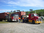 Side loader transport trucks ready to take containers to Adelaide shipping terminal