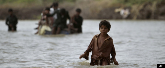 A Pakistani boy displaced by floods walks through flood water towards a road in Badin district near Hyderabad, Pakistan, Sunday, Sept. 18, 2011. The floods caused by heavy rains have killed more than 200 people, made about 200,000 people homeless and left 4.2 million acres of agriculture land inundated with water, authorities said. Muhammed Muheisen / AP Photo