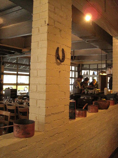 The view of the bar and dining room from Barbuto's kitchen.
