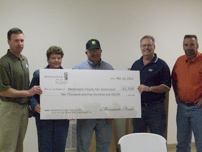 Jeff Hedges from Monsanto, Sue and Steve Norman along with members of the Washington County Fair Board