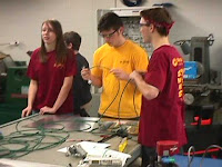 Students cutting pneumatic tubing
