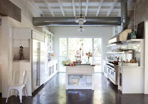 The look of the silver appliances mixed with the while is what I love about this kitchen.