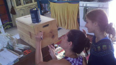 Erin and Serenity decorating the box