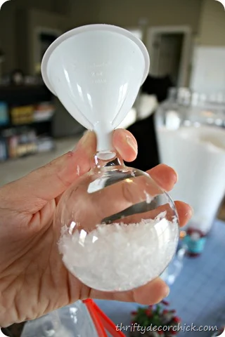 glass ornaments with fake snow