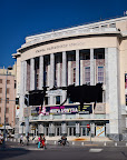 National Theatre drapped in black banners after workers go unpaid for months.