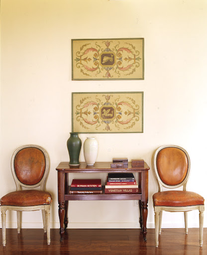 I love the use of vertical space here. Hanging these prints one above another emphasizes the ceiling height. Meanwhile, the chairs create a lovely place to sit. I love the use of vertical space here. Hanging these prints one above another emphasizes the ceiling height. Meanwhile, the chairs create a lovely place to sit.