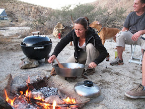 Gina puts the stuffing on the fire.