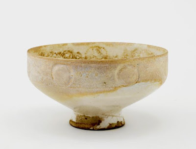 Footed bowl | Origin:  Kashan,  Iran | Period: 12th century  Saljuq period | Details:  Not Available | Type: Earthenware painted with white glaze | Size: W: 8.0  cm | Museum Code: S1997.110 | Photograph and description taken from Freer and the Sackler (Smithsonian) Museums.