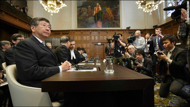 Japanese Ambassador to the Netherlands, Koji Tsuruoka, waits for the verdict in The Hague, Netherlands, on 31 March 2014. The International Court of Justice ruled that Japan can no longer continue its annual whale hunt, rejecting the country's argument that it was for scientific purposes. Photo: AP