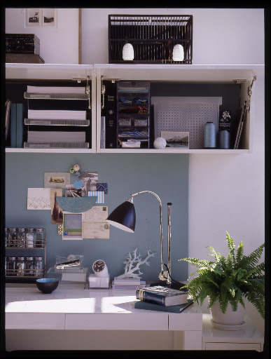 Flip front kitchen cabinets work well in a home office to conceal supplies. Flip front kitchen cabinets work well in a home office to conceal supplies.