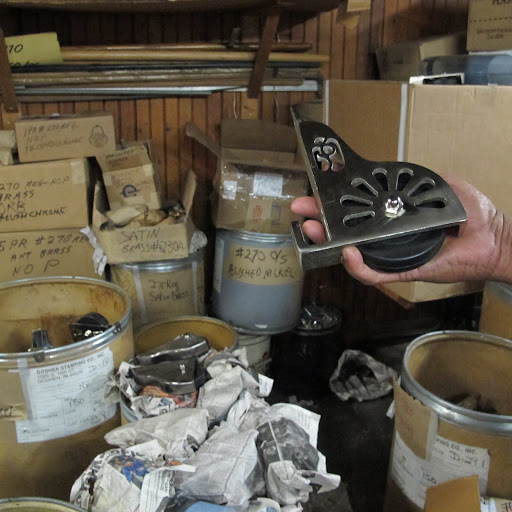 Lloyd shows me one of the ladder wheels.