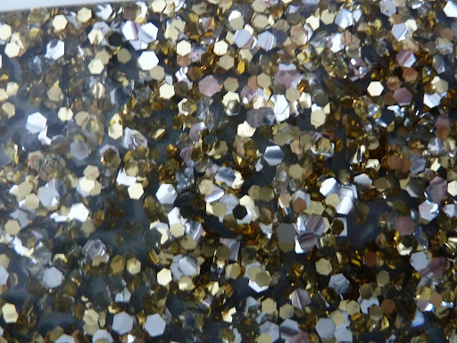 Edie Parker sent us a few clutches that had glitter in lucite. They're smooth but have such depth to them.