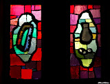 Left: According to legend Simon the Zealot was out to death by a saw.
Right: Judas Iscariot with a money bag StainedWindows-1012.jpg