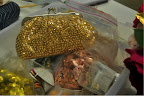 A David's Bridal clutch (http://www.davidsbridal.com) hanging in the glitter bin.