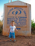 Matimu in front of the sign at the YWAM base outside Tana, where the leader of YWAM Madagascar is. Madagascar6 - 059.jpg