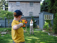 Kai getting riddled with nerf bullets by his cousin Matthew