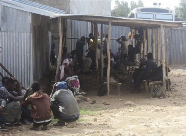 Refugees from Eritrea waiting to be screened by the Ethiopian authorities in Endabaguna town, Wednesday, July 27, 2011, 50 km from the Eritrean border. Ethiopia is home to more than 48,000 Eritrean refugees, mostly young, educated men, or soldiers who have deserted the army. About a 1,000 Eritreans risk their life every month crossing the border into Ethiopia to escape what they say must be the largest open prison in the world. AP