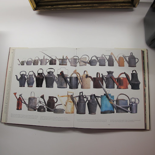 Spread out across two pages, this collection of watering cans looks quite impressive.
