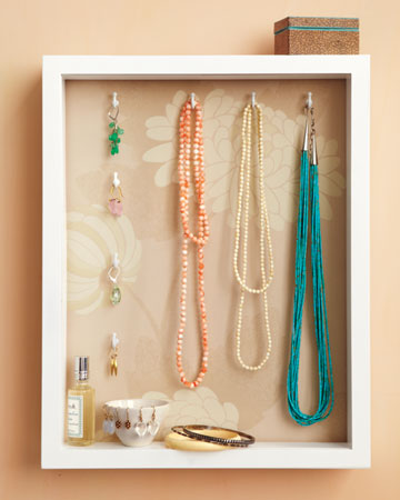 This basic shadowbox becomes a great jewelry holder when fitted with decorative paper and hooks. This basic shadowbox becomes a great jewelry holder when fitted with decorative paper and hooks.