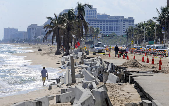 Barricades line the beach next to crumbling sidewalks and seawalls along State Road A1A just north of Sunrise Blvd, 26 November 2012. Photo: Susan Stocker / Sun Sentinel