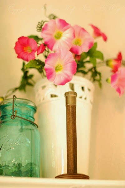 Wooden bobbin with simple metal cap.jpg Wooden bobbin with simple metal cap