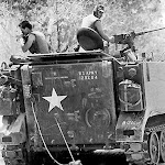 Dead Vietkong soldier inhumanly dragged by US Tank.jpg