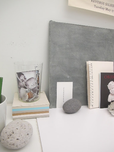 This is such a pretty grouping of objects and the photo displayed in the glass in such a nice idea.