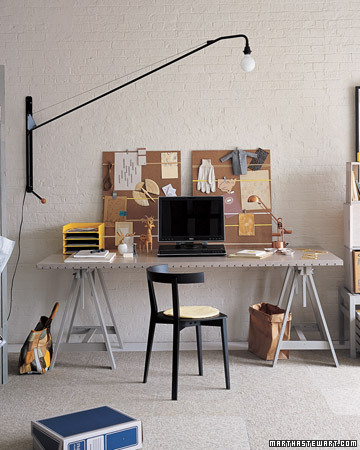 The lamp in the office is so dramatic.  I really like the upholstery tack topped desk as well.