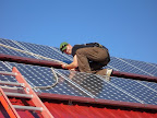 Working on a RESOP Grid Tie Solar Array on Wolfe Island in 2006.