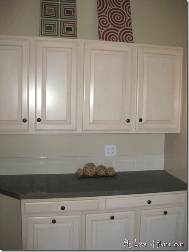 Maple cabinets, brown counter top, DIY art