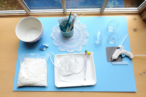 For the custom votive candleholders, you need glass votives, soy wax, wicks, soy-candle coloring, thin boat rope, a pencil, scissors, a thermometer, a double-boiler or pan, a spatula, and a hot-glue gun. For the custom votive candleholders, you need glass votives, soy wax, wicks, soy-candle coloring, thin boat rope, a pencil, scissors, a thermometer, a double-boiler or pan, a spatula, and a hot-glue gun.