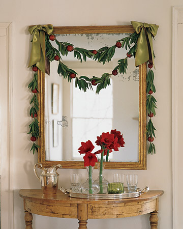Instead of using traditional greenery, infuse your home with bay leaves like we did here. We also included pomegranates for a touch of red.