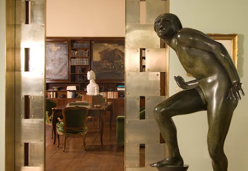 These dramatic doors lead the villa's library. These dramatic doors lead the villa's library.