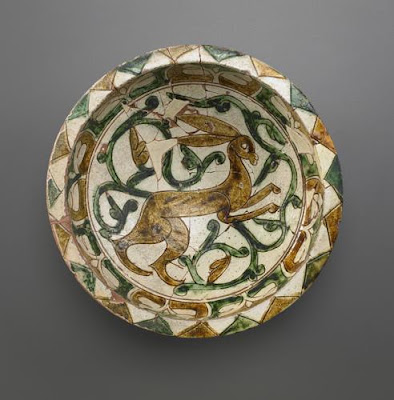 Bowl | Origin:  Iran | Period: 12th-13th century  Saljuq period | Details:  Not Available | Type: Earthenware incised and painted over glaze | Size: H: 8.2  W: 25.1  cm | Museum Code: F1967.4 | Photograph and description taken from Freer and the Sackler (Smithsonian) Museums.