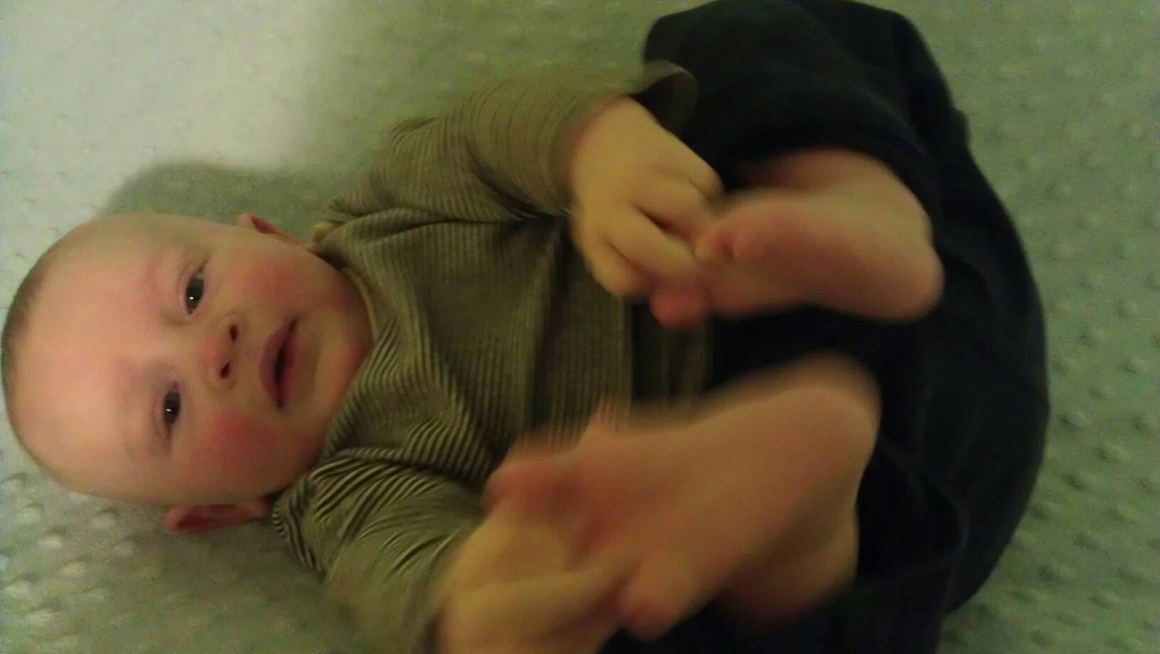 Charlie holding his feet