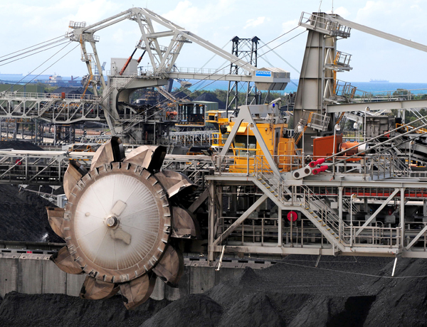 A bucket-wheel on a reclaimer machine loads coal onto a ship at Mackay harbour in Queensland, Australia. Eric Taylor / Bloomberg via Getty Images