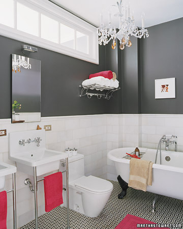 Soft home goods make it easy to be a versatile decorator: the red accents in this room could easily be swapped out for another color such as green or yellow.