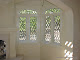 Interior view of copper came window and transom with custom bevels.