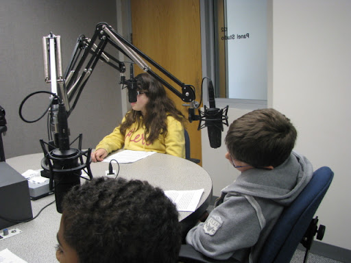 Rountree students listen to instructions on how to record their news update.