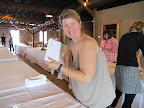 Tables were dressed with tablecloths, friends and family folded napkins, and later set out centerpieces and final touches.