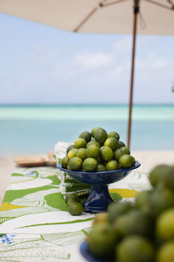 Bowls filled with limes decorated the tables. Bowls filled with limes decorated the tables.